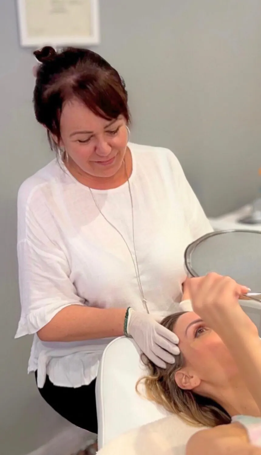 Dawn treating a client's face